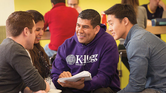 Faculty member talking with students