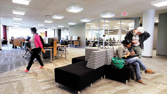 Students walking through the lobby of the Library