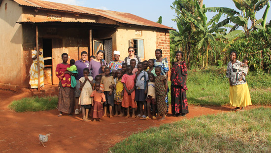 Northwestern students in a village with children.