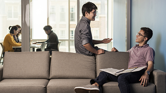 Students in residence hall lounge space