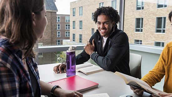 Students in a residence hall study space