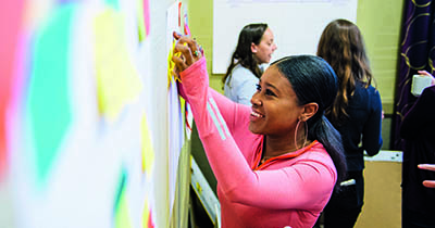 Student working on a white board