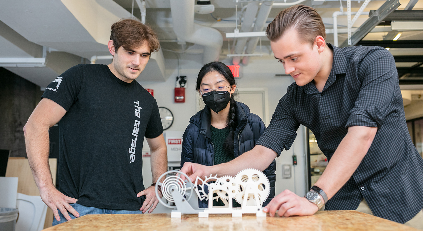 Three students working on a project