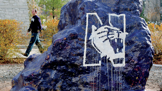 The rock painted with the Northwestern Athletic's logo