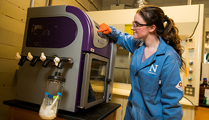 student using lab equipment