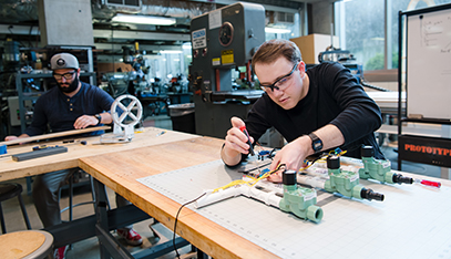 student assembling valves