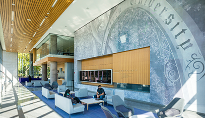 Tour guide showing prospective students campus