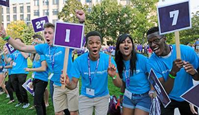 students holding numbered placards