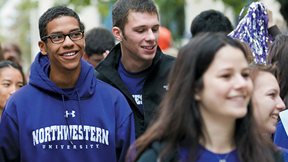 Student walking in a crowd on campus