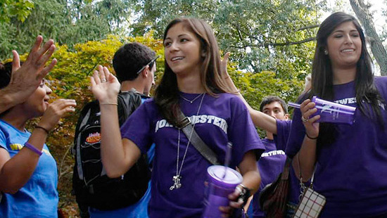 Students walking under the arch